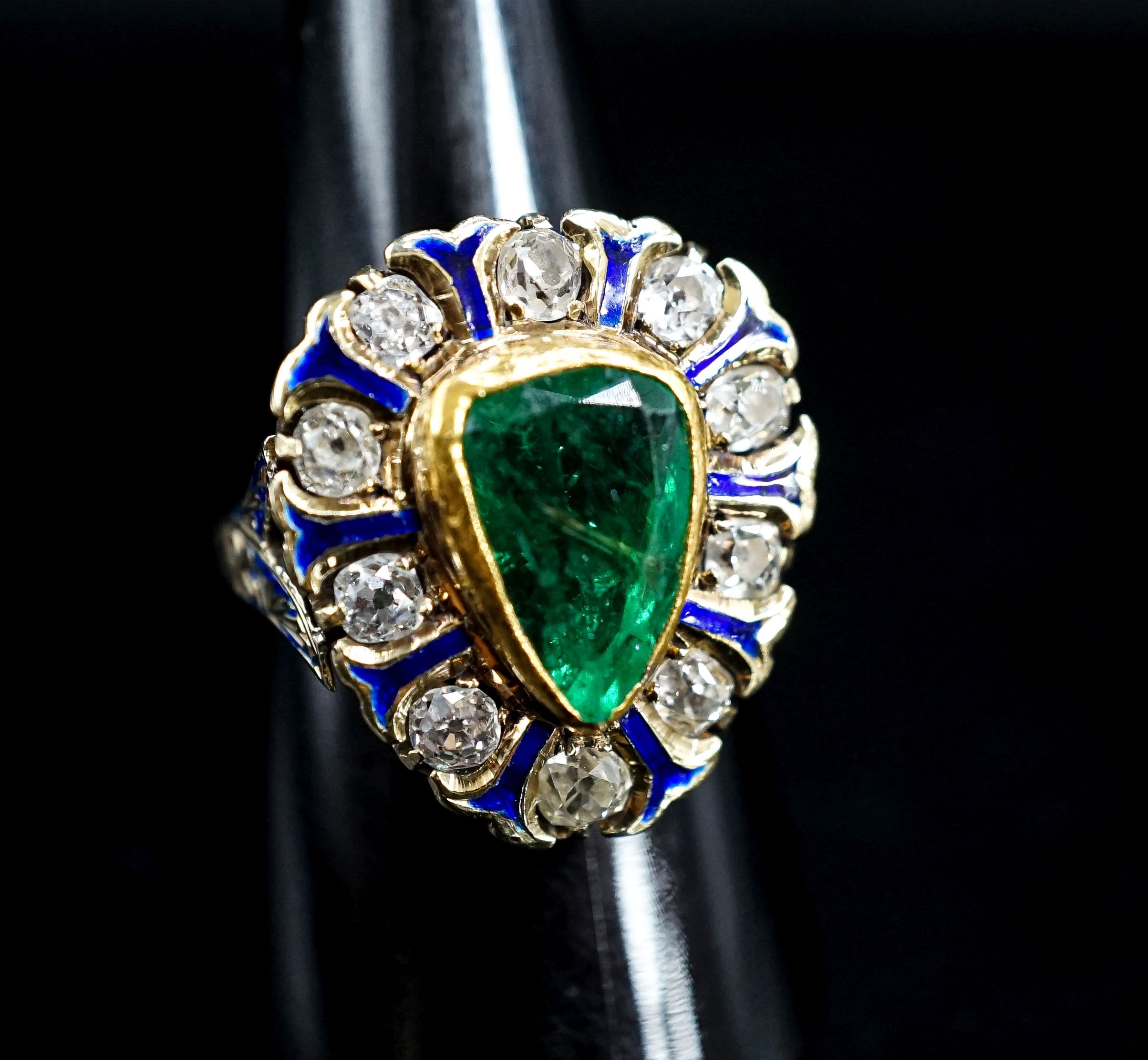 A 14k, emerald, diamond and enamel set pear shaped cluster ring, size Q, gross weight 8.3 grams.